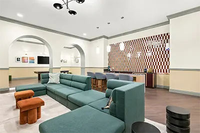 Students hanging out and playing games in the modern community lounge space